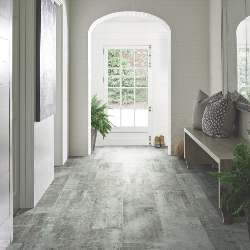 Entryway with gray tile flooring and bright natural light